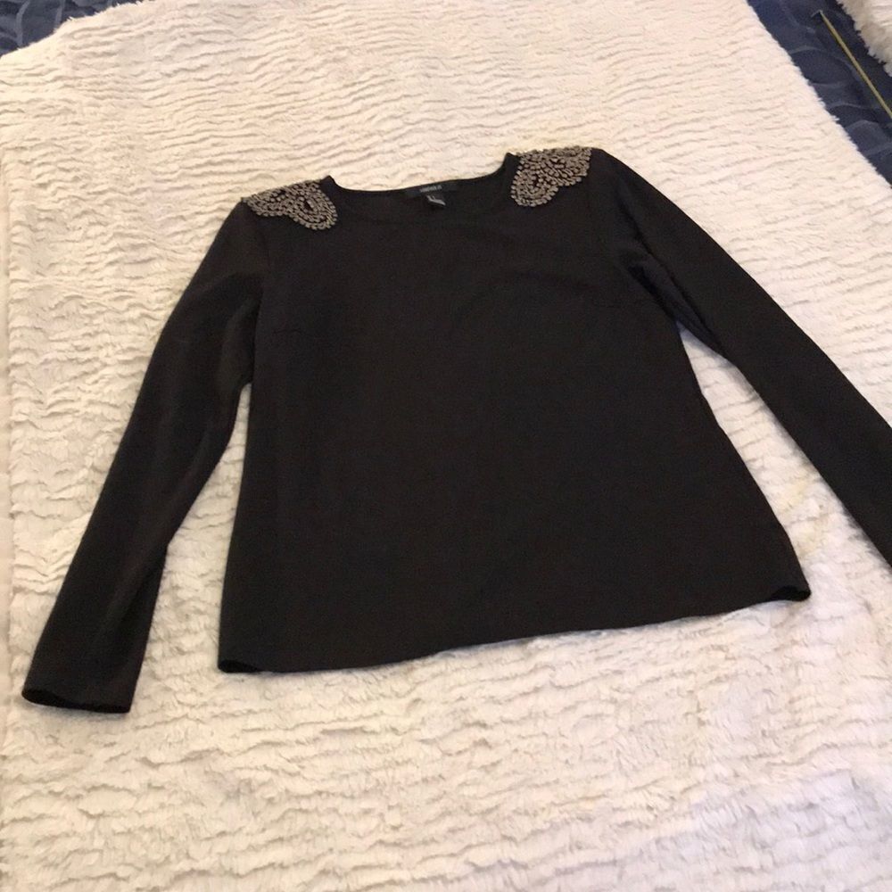 Really cute black top with gold stone detail